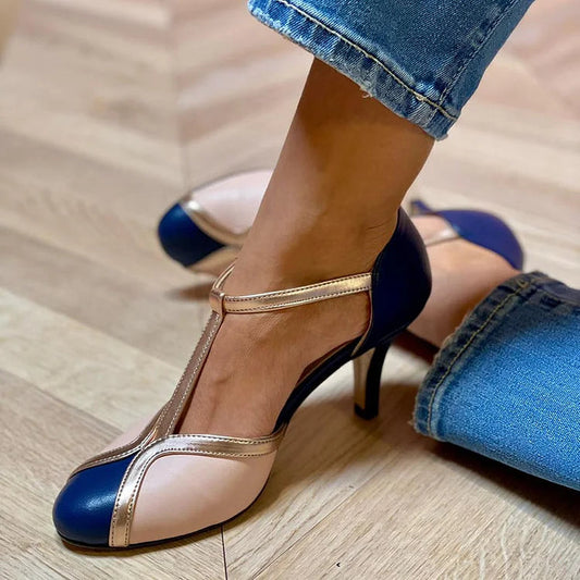 Farbblock-Stiletto-Absätze mit geschlossener runder Zehenpartie und T-Riemen" 

could be rewritten as:

"Farbblock-Stiletto-Pumps mit runder Zehenpartie und T-Riemen
